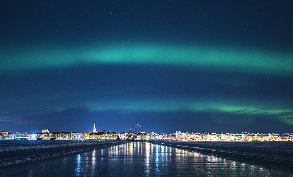 noorderlicht tijdens schaatsen in Zweden